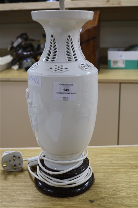A Chinese figural whiteware lamp on wooden base